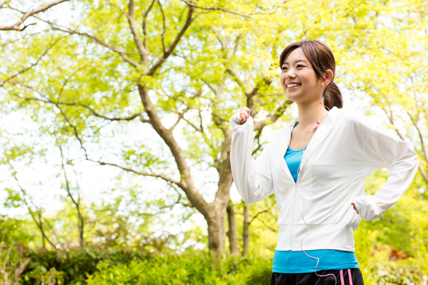 young asian woman jogging in the park