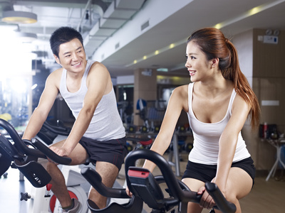 man and woman talking in gym